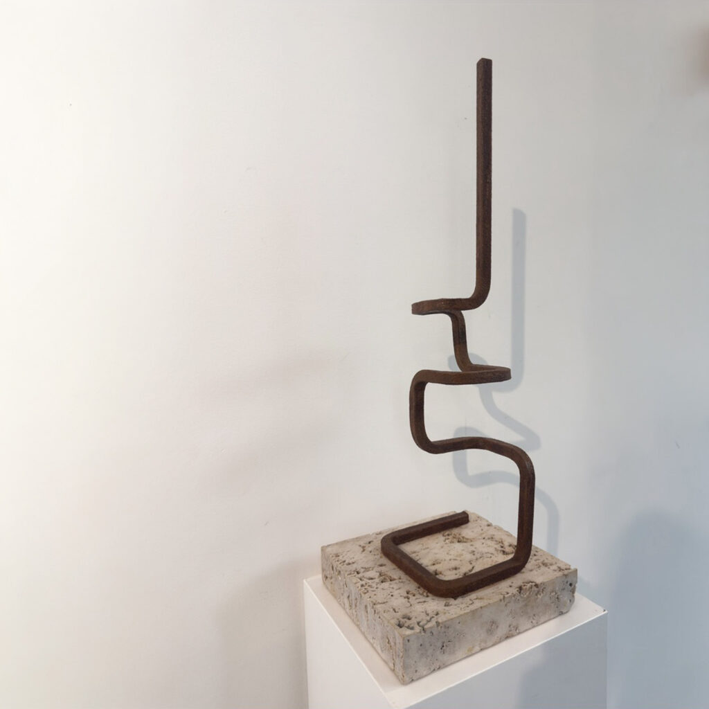 La Ligne, 2025, corten steel, travertine stone base, 70 × 25 × 25 cm